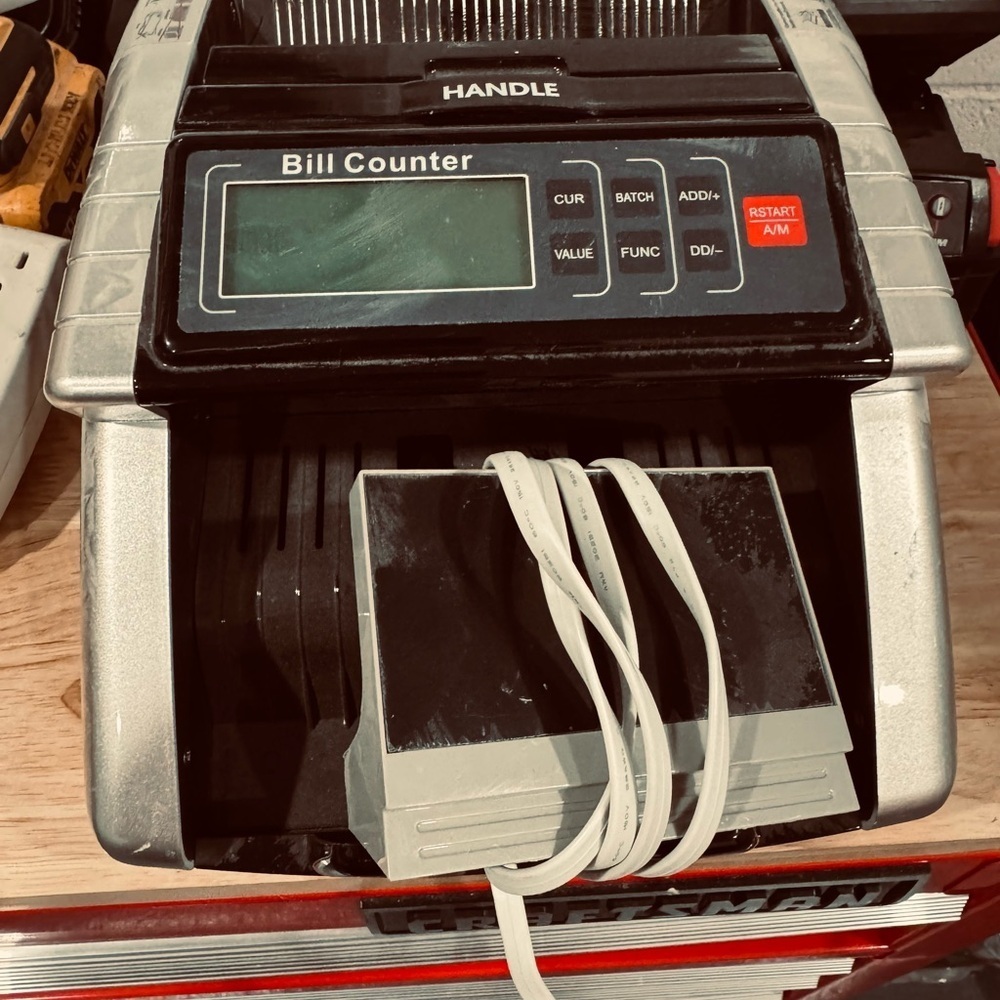 Silver and Black Bill Counter